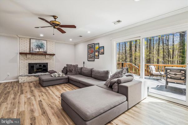 Fireplace, Interior, Living room, Recessed Lighting, Stone Walls, Wood Texture Flooring