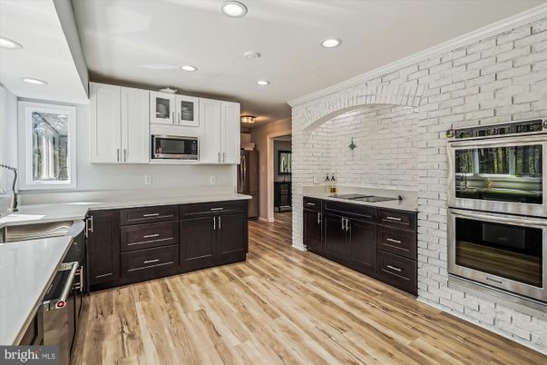 Interior, Kitchen, Recessed Lighting, Stainless Steel Appliances, Stone Walls, Wood Texture Flooring