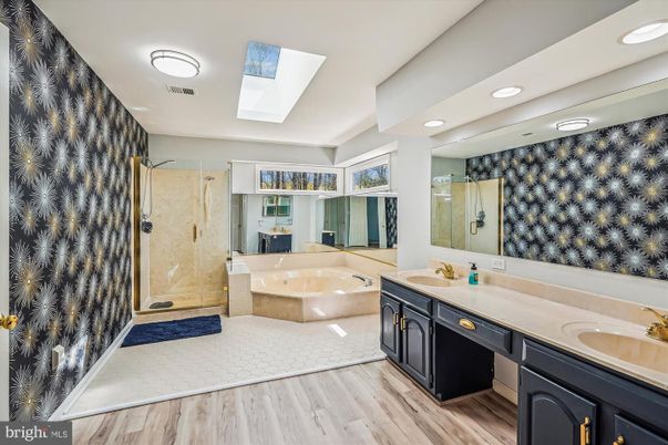 Bathroom, Dual Sink Vanities, Glass Shower, Interior, Recessed Lighting, Wood Texture Flooring