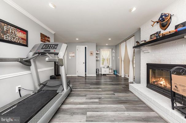 Fireplace, Fitness Equipment, Interior, Recessed Lighting, Wood Texture Flooring