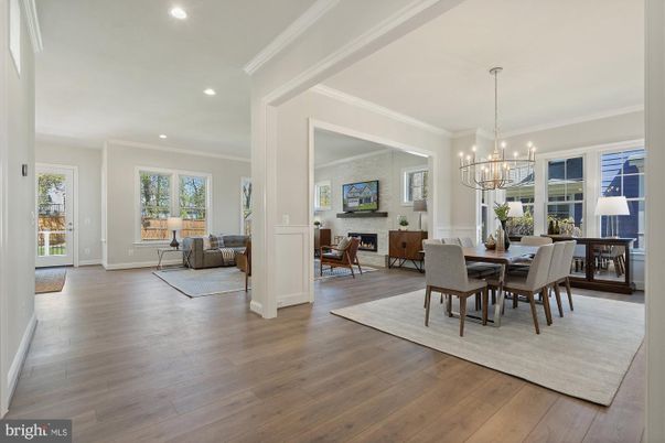 Chandelier, Dining room, Fireplace, Interior, Living room, Recessed Lighting, Wood Texture Flooring
