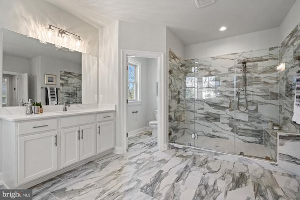 Bathroom, Dual Sink Vanities, Glass Shower, Interior, Marble, Marble Walls, Recessed Lighting