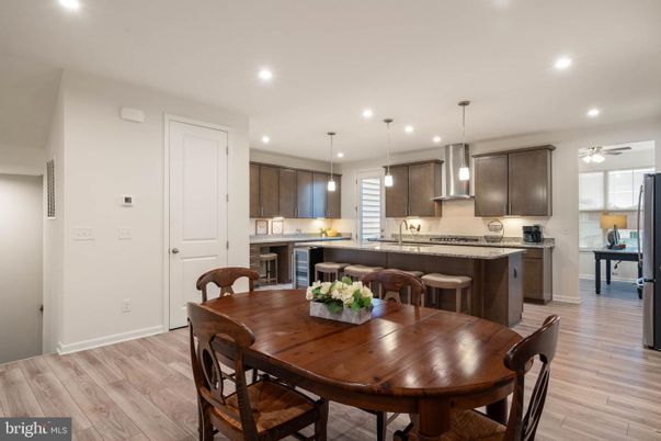 Dining room, Interior, Kitchen, Pendant Lights, Recessed Lighting, Stainless Steel Appliances, Wood Texture Flooring