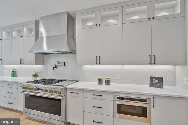 Interior, Kitchen, Marble Walls, Stainless Steel Appliances, Wood Texture Flooring