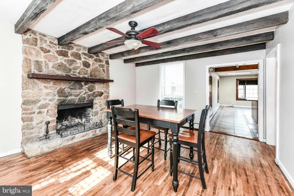 Dining room, Fireplace, Interior, Stone Walls, Wooden Beams, Wood Texture Flooring