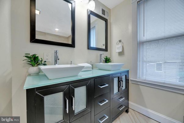 Bathroom, Dual Sink Vanities, Interior, Recessed Lighting, Wood Texture Flooring