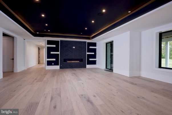 Empty room, Fireplace, Interior, Marble Walls, Recessed Lighting, Wood Texture Flooring