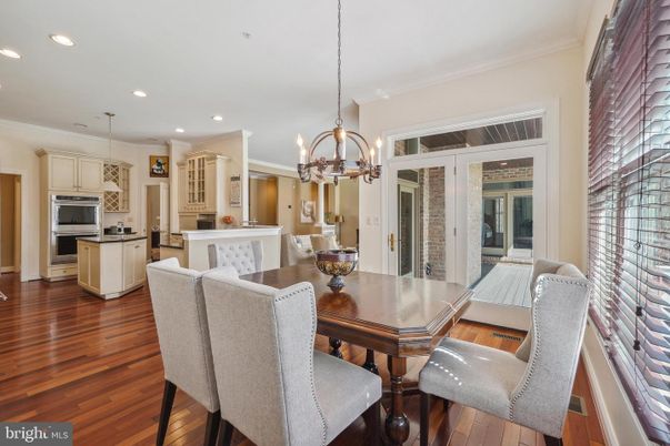 Chandelier, Dining room, Interior, Kitchen, Pendant Lights, Recessed Lighting, Stainless Steel Appliances, Wood Texture Flooring