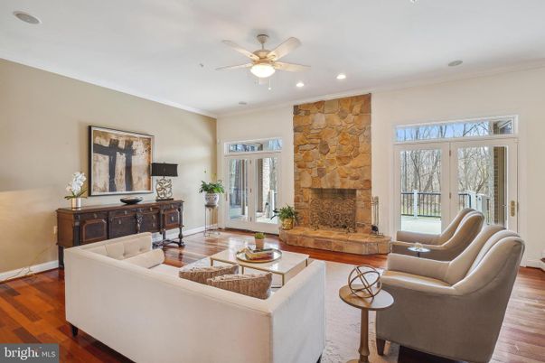 Fireplace, Interior, Living room, Recessed Lighting, Stone Walls, Wood Texture Flooring