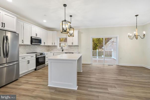 Chandelier, Interior, Kitchen, Pendant Lights, Recessed Lighting, Stainless Steel Appliances, Wood Texture Flooring