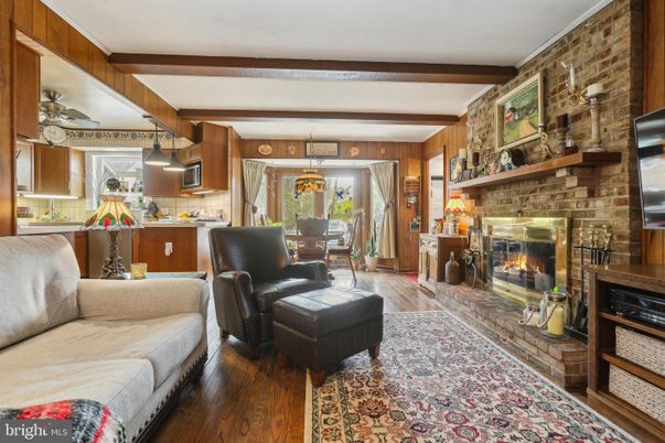 Dining room, Fireplace, Interior, Kitchen, Living room, Pendant Lights, Stone Walls, Wooden Beams, Wood Texture Flooring
