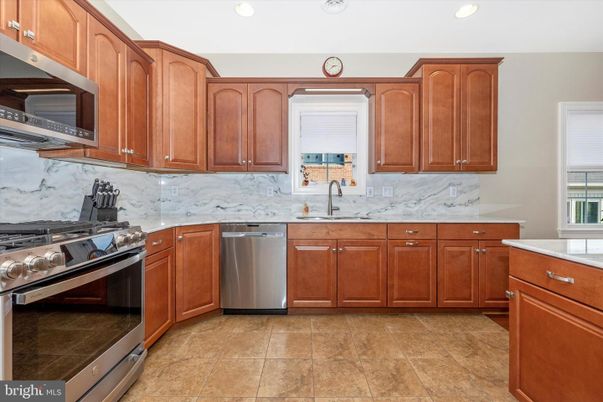 Interior, Kitchen, Marble Walls, Recessed Lighting, Stainless Steel Appliances