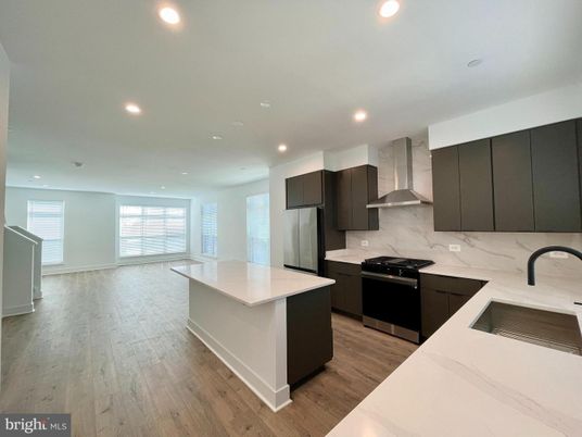 Interior, Kitchen, Marble Walls, Recessed Lighting, Stainless Steel Appliances, Wood Texture Flooring
