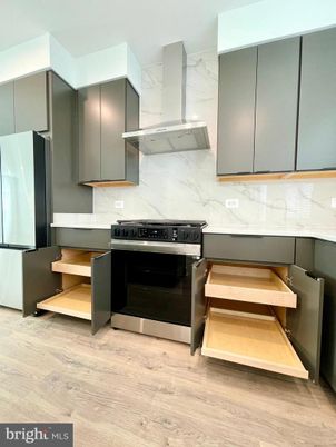 Interior, Kitchen, Marble Walls, Stainless Steel Appliances, Wood Texture Flooring