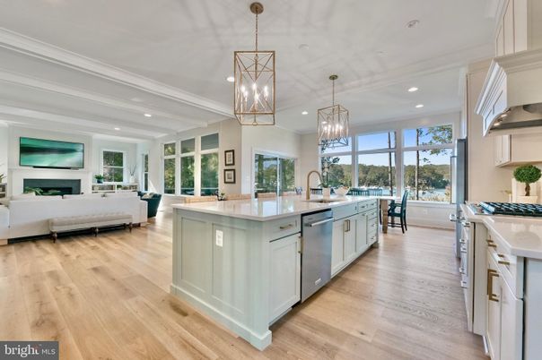 Chandelier, Dining room, Fireplace, Interior, Kitchen, Living room, Pendant Lights, Recessed Lighting, Stainless Steel Appliances, Wood Texture Flooring