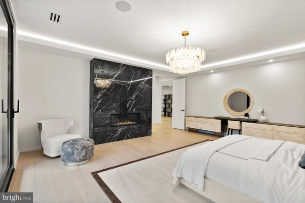 Bedroom, Chandelier, Fireplace, Interior, Marble Walls, Recessed Lighting, Wood Texture Flooring