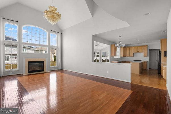 Chandelier, Empty room, Fireplace, Interior, Kitchen, Recessed Lighting, Wood Texture Flooring
