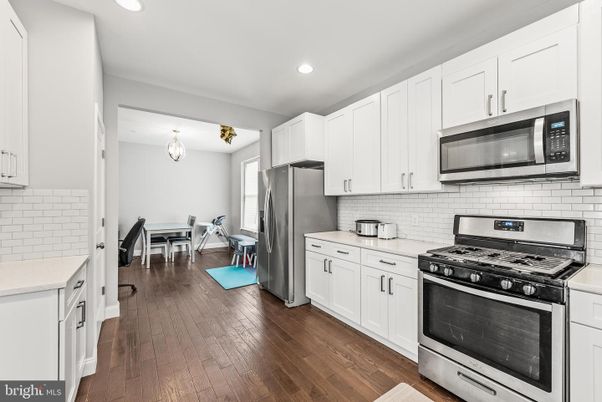 Dining room, Interior, Kitchen, Recessed Lighting, Stainless Steel Appliances, Wood Texture Flooring