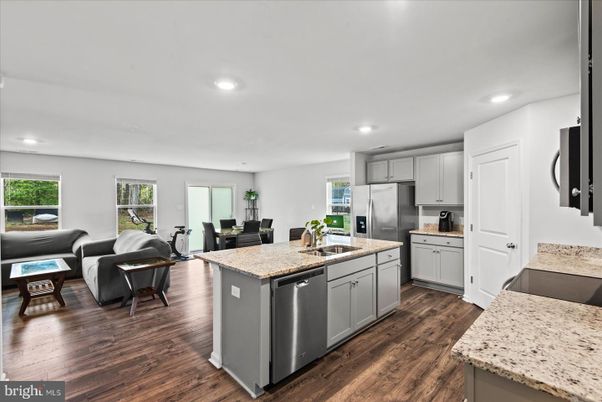 Dining room, Interior, Kitchen, Living room, Recessed Lighting, Stainless Steel Appliances, Wood Texture Flooring