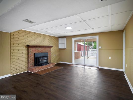 Empty room, Fireplace, Interior, Recessed Lighting, Stone Walls, Wood Texture Flooring