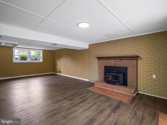 Empty room, Fireplace, Interior, Recessed Lighting, Stone Walls, Wood Texture Flooring