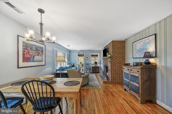 Dining room, Fireplace, Interior, Living room, Pendant Lights, Stone Walls, Wood Texture Flooring