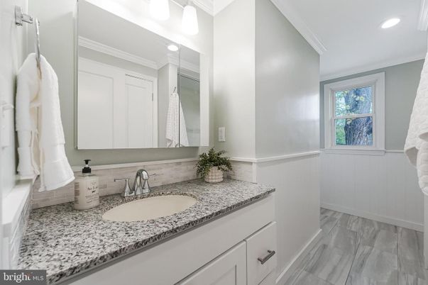 Bathroom, Dual Sink Vanities, Interior, Recessed Lighting, Wood Texture Flooring