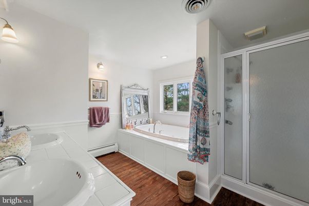 Bathroom, Dual Sink Vanities, Glass Shower, Interior, Recessed Lighting, Tile Countertops, Wood Texture Flooring