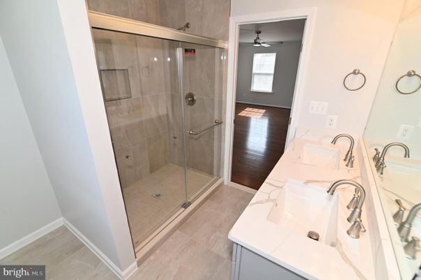 Bathroom, Dual Sink Vanities, Glass Shower, Interior, Wood Texture Flooring