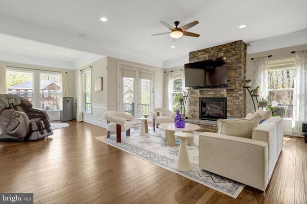 Fireplace, Interior, Living room, Recessed Lighting, Stone Walls, Wood Texture Flooring