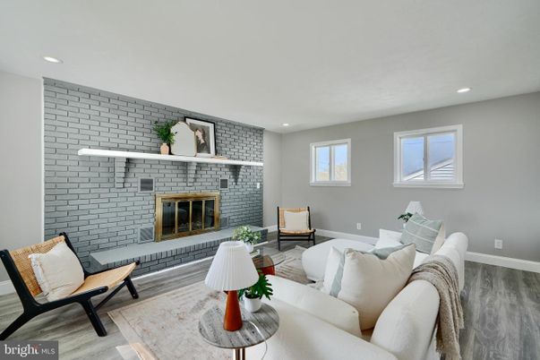 Fireplace, Interior, Living room, Recessed Lighting, Stone Walls, Wood Texture Flooring