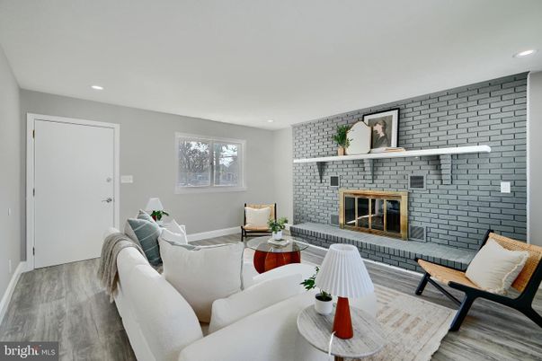 Fireplace, Interior, Living room, Recessed Lighting, Stone Walls, Wood Texture Flooring