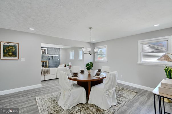 Dining room, Fireplace, Interior, Living room, Pendant Lights, Recessed Lighting, Wood Texture Flooring