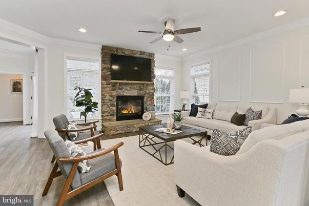 Fireplace, Interior, Living room, Recessed Lighting, Stone Walls, Wood Texture Flooring
