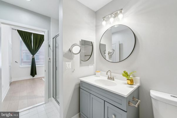 Bathroom, Dual Sink Vanities, Interior, Recessed Lighting, Wood Texture Flooring