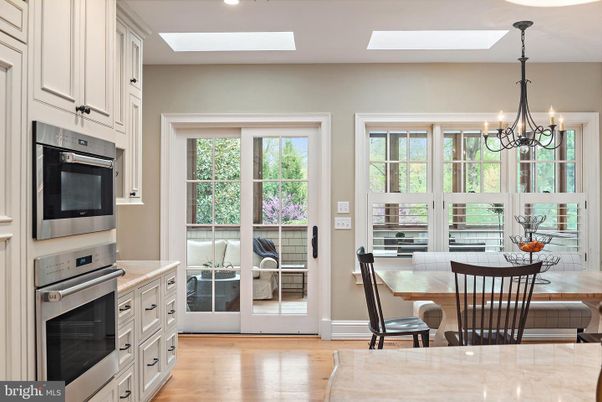 Chandelier, Dining room, Interior, Kitchen, Recessed Lighting, Stainless Steel Appliances, Wood Texture Flooring