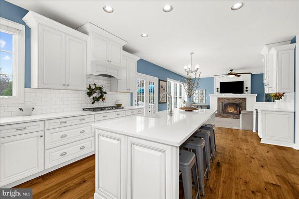 Chandelier, Fireplace, Interior, Kitchen, Pendant Lights, Recessed Lighting, Wood Texture Flooring