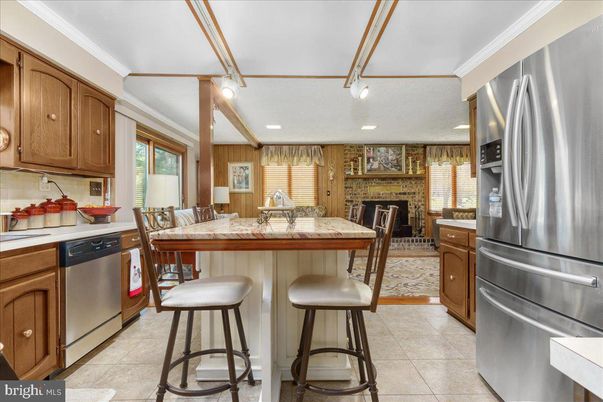 Dining room, Fireplace, Interior, Kitchen, Recessed Lighting, Stainless Steel Appliances, Stone Walls, Wooden Walls