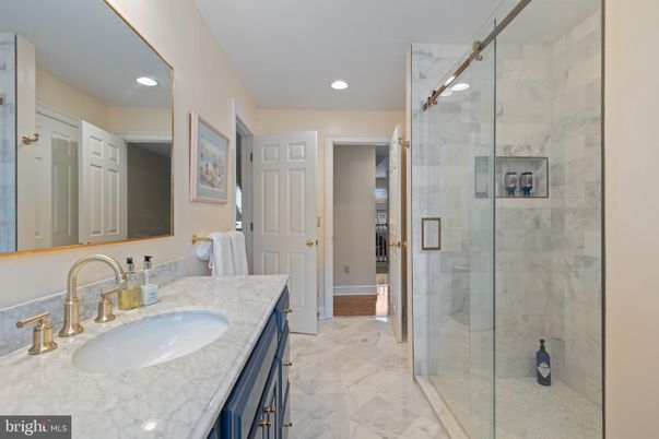 Bathroom, Dual Sink Vanities, Glass Shower, Interior, Marble, Marble Walls, Recessed Lighting