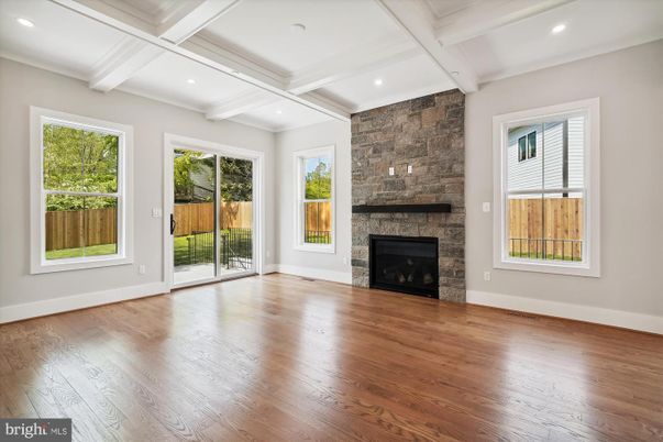 Empty room, Fireplace, Interior, Recessed Lighting, Stone Walls, Wood Texture Flooring
