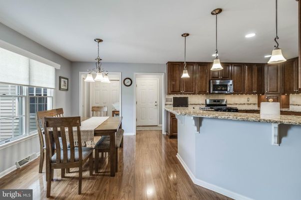 Dining room, Interior, Kitchen, Pendant Lights, Recessed Lighting, Stainless Steel Appliances, Wood Texture Flooring
