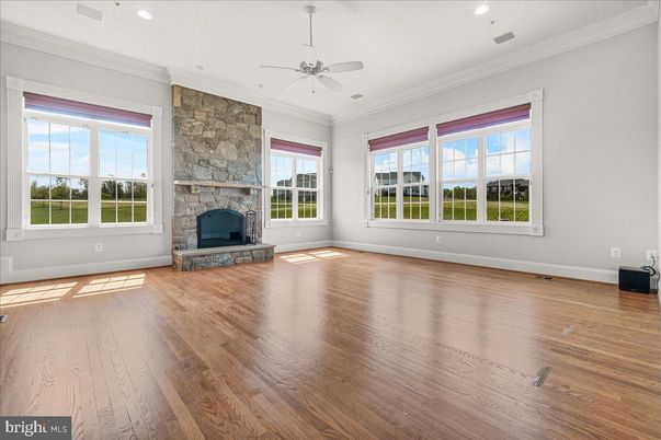 Empty room, Fireplace, Interior, Recessed Lighting, Stone Walls, Wood Texture Flooring
