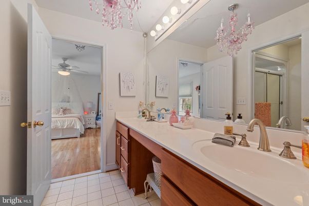 Bathroom, Bedroom, Chandelier, Dual Sink Vanities, Interior, Wood Texture Flooring