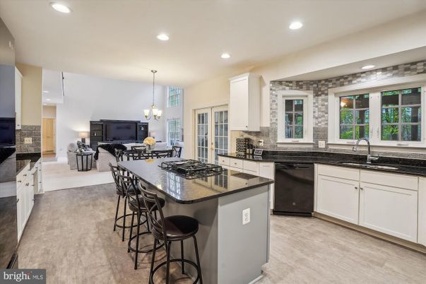 Chandelier, Dining room, Interior, Kitchen, Pendant Lights, Recessed Lighting, Stainless Steel Appliances, Wood Texture Flooring