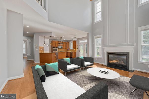 Fireplace, Interior, Kitchen, Living room, Pendant Lights, Recessed Lighting, Stainless Steel Appliances, Wood Texture Flooring