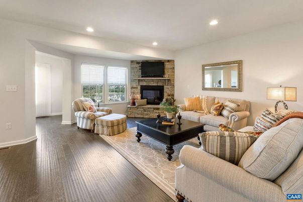 Fireplace, Interior, Living room, Recessed Lighting, Stone Walls, Wood Texture Flooring