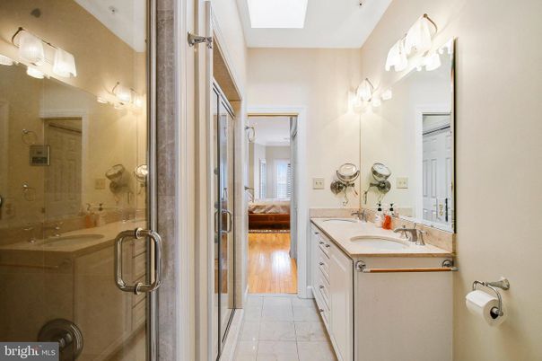 Bathroom, Dual Sink Vanities, Glass Shower, Interior, Wood Texture Flooring
