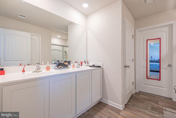 Bathroom, Dual Sink Vanities, Interior, Recessed Lighting, Wood Texture Flooring