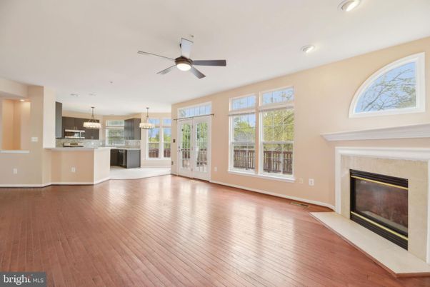 Empty room, Fireplace, Interior, Kitchen, Pendant Lights, Recessed Lighting, Wood Texture Flooring