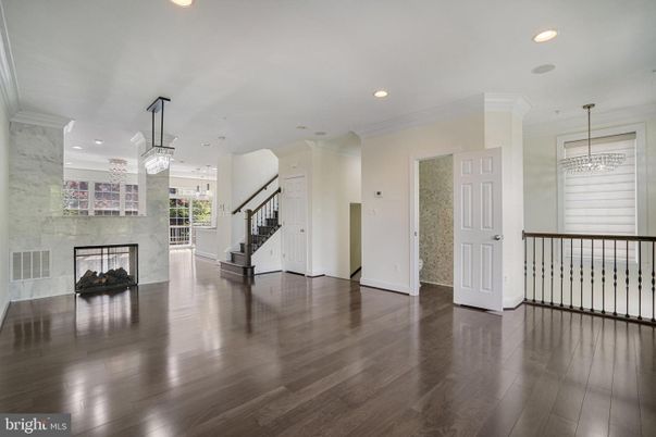 Chandelier, Empty room, Fireplace, Interior, Pendant Lights, Recessed Lighting, Wood Texture Flooring